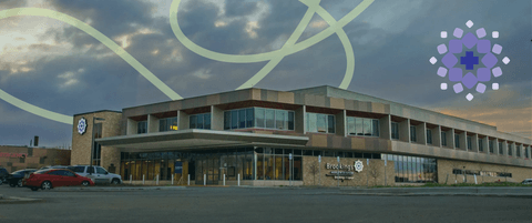 A stylized photo of the hospital at Brookings Health System with a B H S logo.